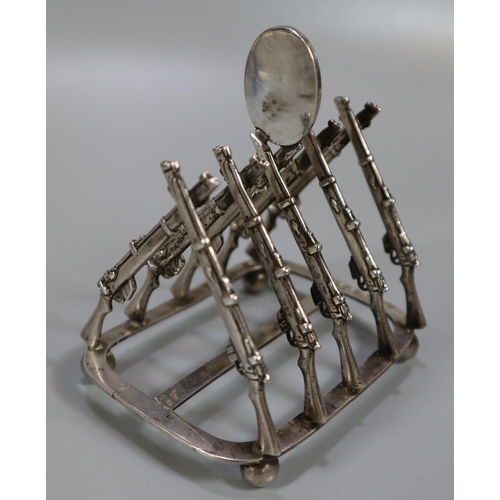 265 - Silver shooting trophy four division toast rack, the divisions in the form of Lee Enfield rifles, ha... 