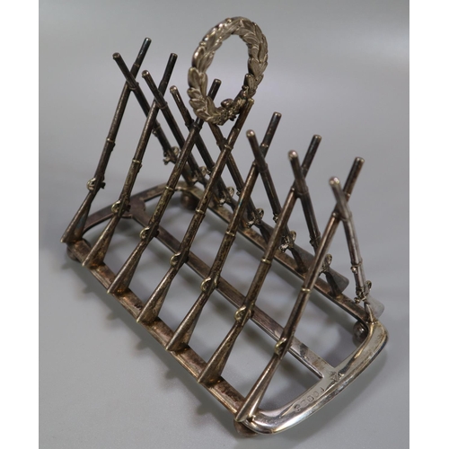 265 - Silver shooting trophy four division toast rack, the divisions in the form of Lee Enfield rifles, ha... 