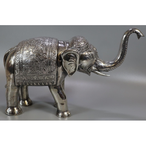 267 - Unusual, probably 19th century, Indian white metal caparisoned Indian elephant with headdress and fo... 