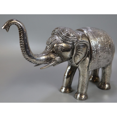 267 - Unusual, probably 19th century, Indian white metal caparisoned Indian elephant with headdress and fo... 