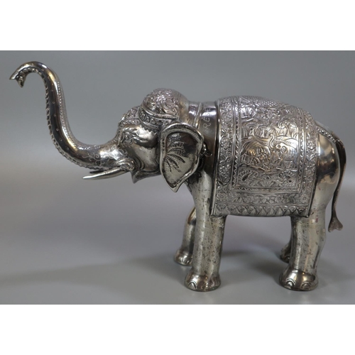 267 - Unusual, probably 19th century, Indian white metal caparisoned Indian elephant with headdress and fo... 