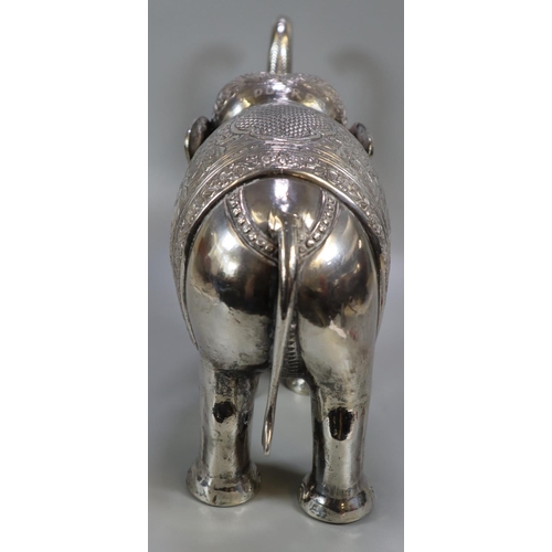 267 - Unusual, probably 19th century, Indian white metal caparisoned Indian elephant with headdress and fo... 