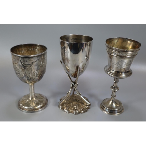 271 - Three silver and silver plate trophy cups to include: vine leaf repousse decorated cup presented by ... 