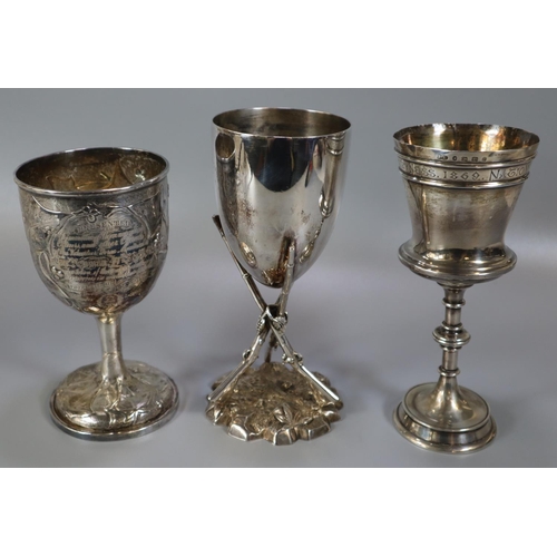 271 - Three silver and silver plate trophy cups to include: vine leaf repousse decorated cup presented by ... 