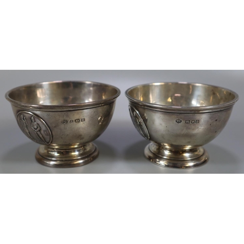 272 - A group of silver shooting trophy cups or beakers to include: Bisley 1906 and another similar. With ... 