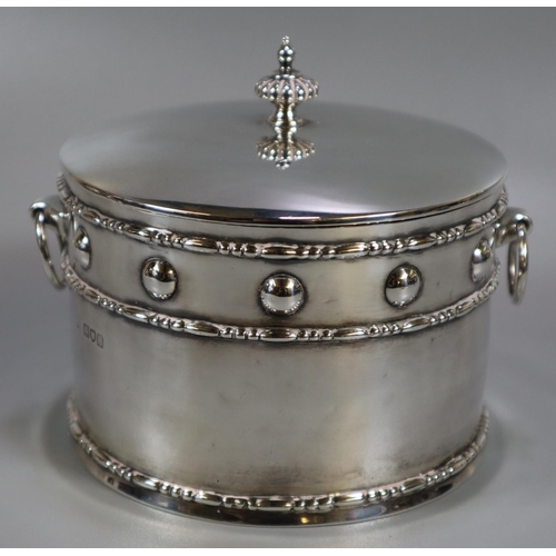 274 - Silver Arts & Crafts design silver drum shaped two handled box and cover. The dome cover with fluted... 