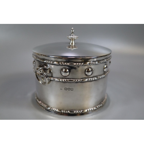 274 - Silver Arts & Crafts design silver drum shaped two handled box and cover. The dome cover with fluted... 