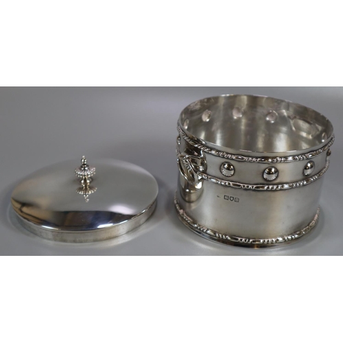 274 - Silver Arts & Crafts design silver drum shaped two handled box and cover. The dome cover with fluted... 