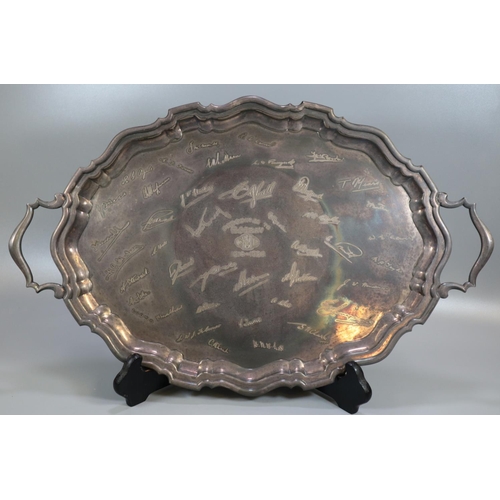 276 - Oval two handled silver piecrust edge presentation tray, overall with engraved signatures. Birmingha... 