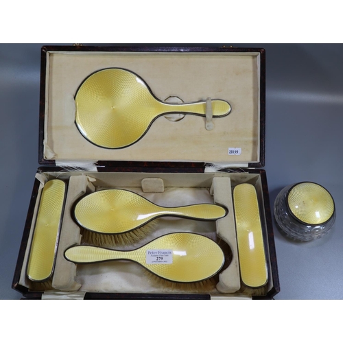 279 - Silver yellow guilloche enamel cased dressing table set comprising: four brushes and a hand mirror, ... 