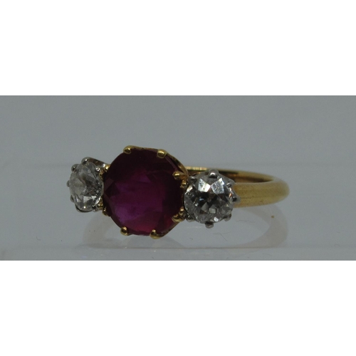 315 - A synthetic ruby and diamond three stone ring.  Ring size L & 1/2.  Approx weight 3.8 grams.
(B.P. 2... 