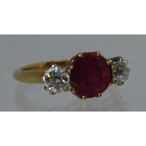 315 - A synthetic ruby and diamond three stone ring.  Ring size L & 1/2.  Approx weight 3.8 grams.
(B.P. 2... 