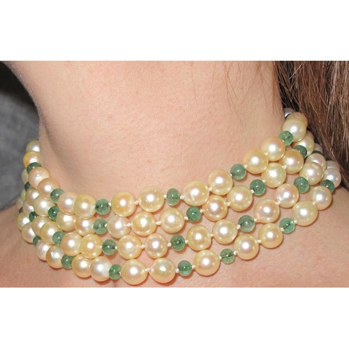 317 - A Seaman Schepps emerald and pearl four row choker with 14ct gold ornate clasp set with emeralds, di... 