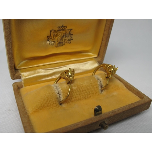 323 - A pair of Greek Bull's Head earrings.  Together with Southeby's sale tags 15th July 1980.  Approx we... 