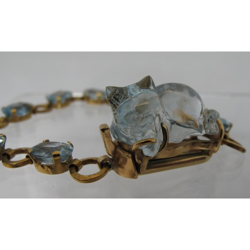 324 - An aquamarine bracelet of nine oval cut aquamarine stones, the clasp set with a large aquamarine car... 