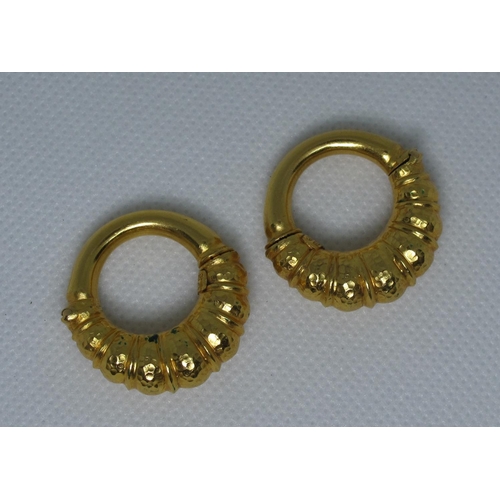 325 - A pair of 18ct gold greek hoop earrings.  Clip fittings.  Approx weight 18 grams.
(B.P. 21% + VAT)