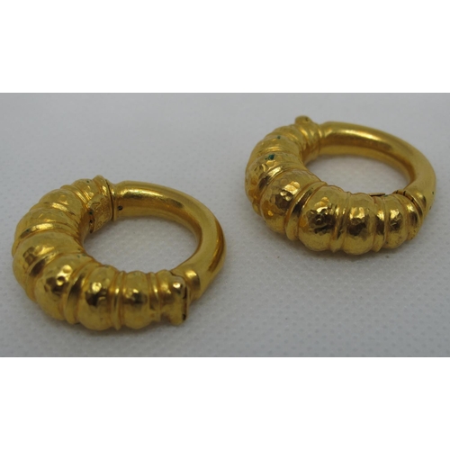 325 - A pair of 18ct gold greek hoop earrings.  Clip fittings.  Approx weight 18 grams.
(B.P. 21% + VAT)