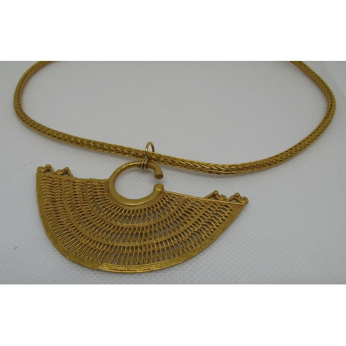 327 - Yellow metal pendant on 18ct gold chain.  Approx weight 35 grams.
(B.P. 21% + VAT)