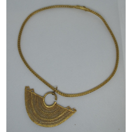 327 - Yellow metal pendant on 18ct gold chain.  Approx weight 35 grams.
(B.P. 21% + VAT)