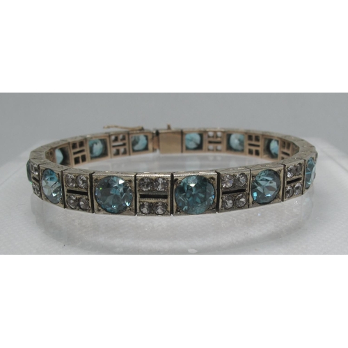 332 - An Art Deco blue and white zircon bracelet set in silver 17.25 inches (18.5cm).  Approx weight 33 gr... 