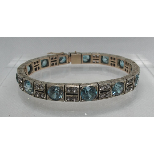 332 - An Art Deco blue and white zircon bracelet set in silver 17.25 inches (18.5cm).  Approx weight 33 gr... 