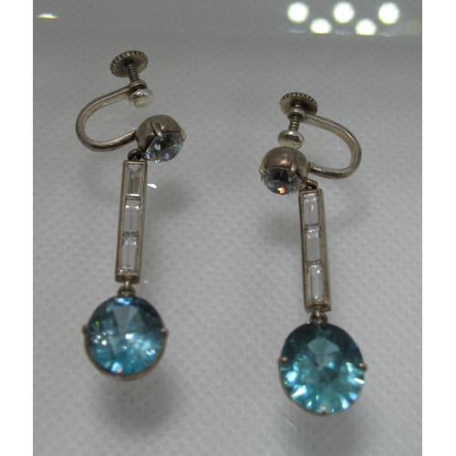 333 - A pair of Art Deco blue and white zircon earrings with screw back fittings.  Approx weight 7.3 grams... 