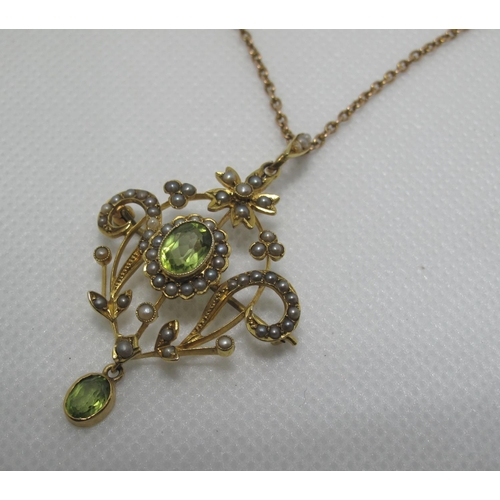 353 - 9ct gold Art Nouveau pendant set with peridot and pearls on 9ct gold chain.  Approx weight 7.8 grams... 