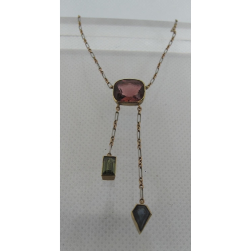 354 - Art Deco Pink stone pendant with green tourmaline and sapphire drops.  Approx weight 4.3 grams.
(B.P... 