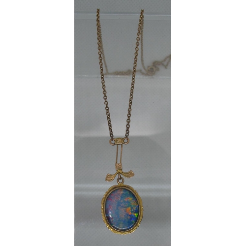 355 - An Edwardian opal pendant set in yellow metal on a yellow metal chain.  Approx weight 4.1 grams.
(B.... 