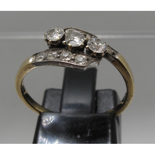 363 - Diamond three stone ring set on a twist with diamond shoulders.  Ring size O&1/2.  Approx weight 2.2... 