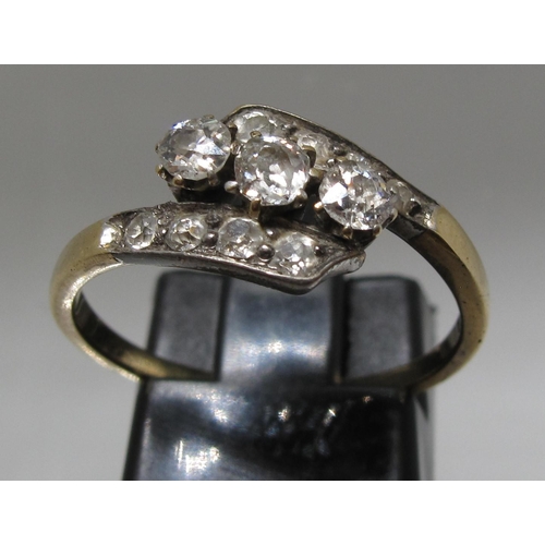 363 - Diamond three stone ring set on a twist with diamond shoulders.  Ring size O&1/2.  Approx weight 2.2... 