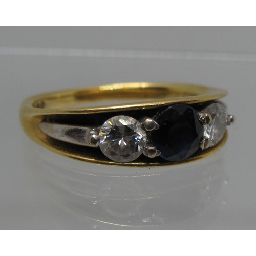 364 - 18ct gold three stone diamond and sapphire ring.  Ring size M.  Approx weight 4.1 grams.
(B.P. 21% +... 