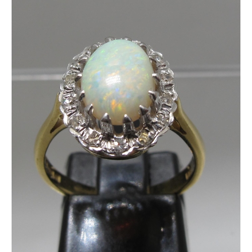 368 - 18ct opal and diamond ring.  Ring size M&1/2.  Approx weight 4.5 grams.
(B.P. 21% + VAT)