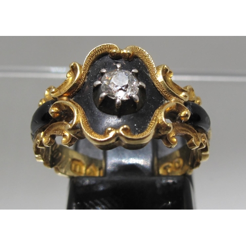 373 - William IV 18ct gold mourning ringset with a diamond on a black enamel ground within a scrolling gol... 