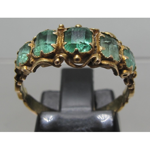 375 - Victorian five stone emerald ring with engraved band.  Ring size O.  Approx weight 2.5 grams.
(B.P. ... 