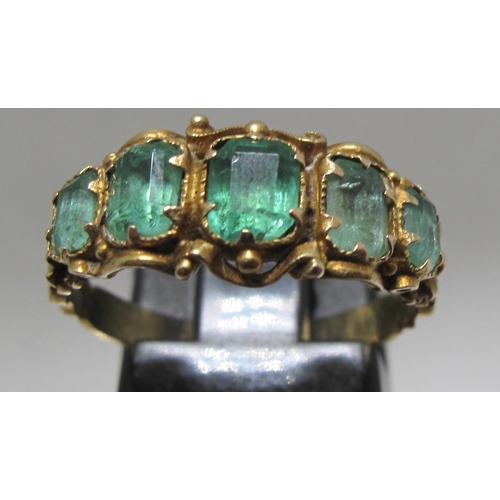 375 - Victorian five stone emerald ring with engraved band.  Ring size O.  Approx weight 2.5 grams.
(B.P. ... 