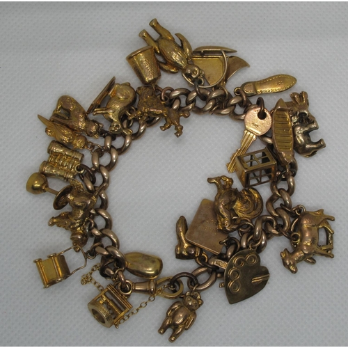 383 - A 9ct gold charm bracelet with various 9ct gold and yellow metal charms including a sailing ship, pr... 