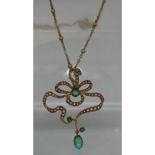 389 - An Art Nouveau pendant set with seed pearls and turquoise on a 9ct gold chain.  Approx weight 7.5 gr... 