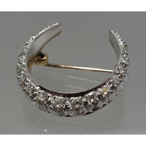 391 - A 9ct gold and diamond Victorian style crescent brooch.  Approx weight 4.9 grams.
(B.P. 21% + VAT)