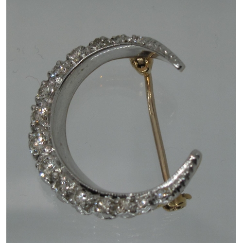 391 - A 9ct gold and diamond Victorian style crescent brooch.  Approx weight 4.9 grams.
(B.P. 21% + VAT)