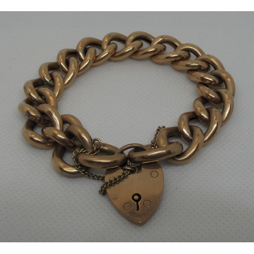 395 - A Victorian 9ct gold hollow curb link bracelet with heart shaped clasp.  Approx weight 21 grams.
(B.... 