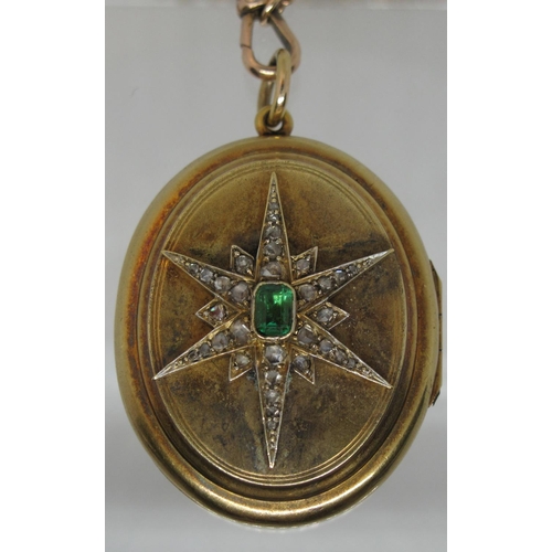 397 - A Victorian oval locket set to the front with an emerald and diamond starburst.  Approx weight 26.5 ... 