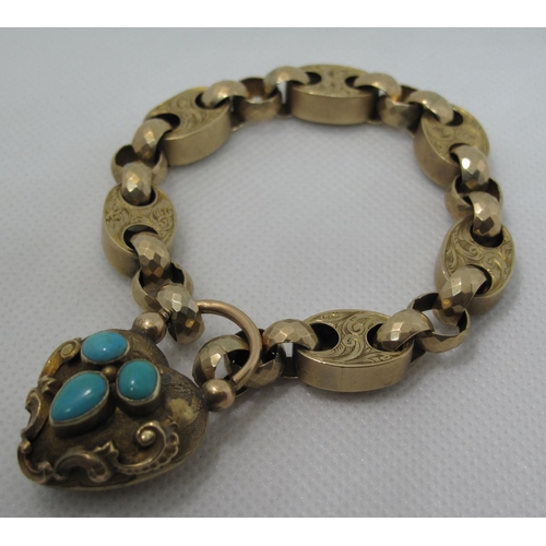 398 - A Victorian yellow metal bracelet of stamped engraved links. The heart shaped padlock clasp decorate... 