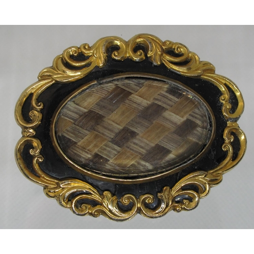 400 - Victorian yellow metal and black enamel mourning brooch with central section of woven hair.  Engrave... 