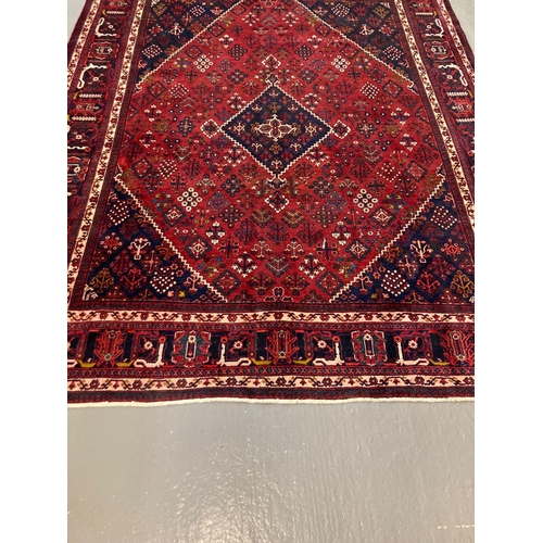 442 - Large Persian Joshaghan carpet, with diamond medallion design and stylised flower and foliate decora... 