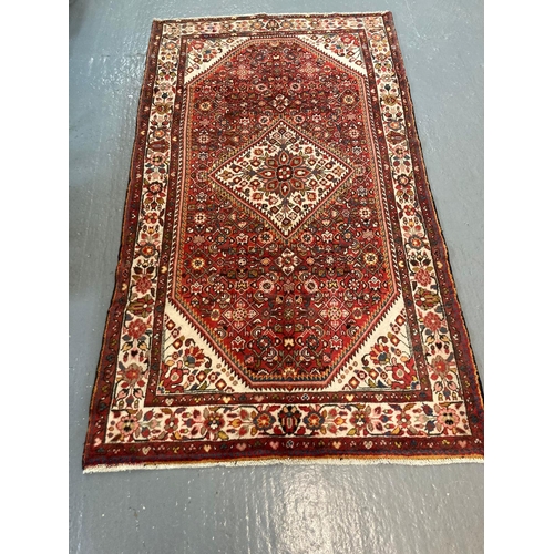 449 - Fine woven full pile Persian Hosseinabad rug.  290x136cm approx.   (B.P. 21% + VAT)