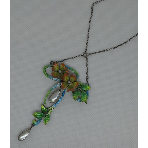 405 - An Art Nouveau silver and enamel pendant modelled as two pearl set flowers amongst foliage with moth... 