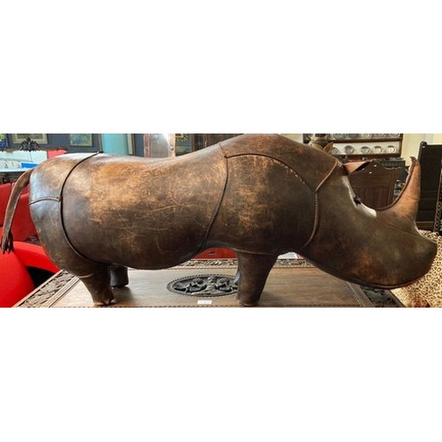 78A - Leather novelty footstool in the form of a rhino, probably retailed by Liberty's. Unmarked. 110cm lo... 