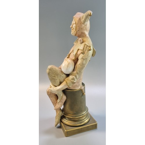 200 - Late 19th century Doulton Burslem figure, 'Jester' resting on a plinth. Signed by Noke  25cm high ap... 