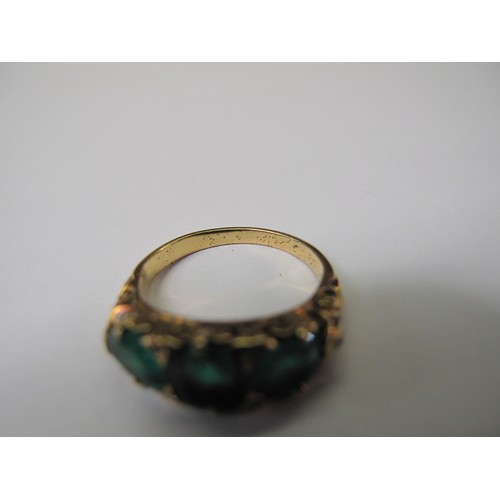 316 - A three stone emerald ring set in yellow metal.  Ring size M & 1/2.  Approx weight 4.8 grams.
(B.P. ... 